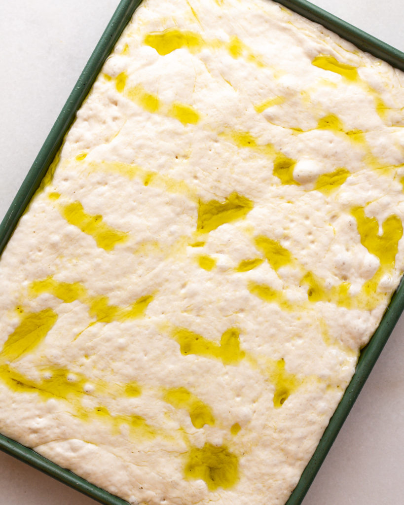 Genoa Style Focaccia dough in pan with olive oil
