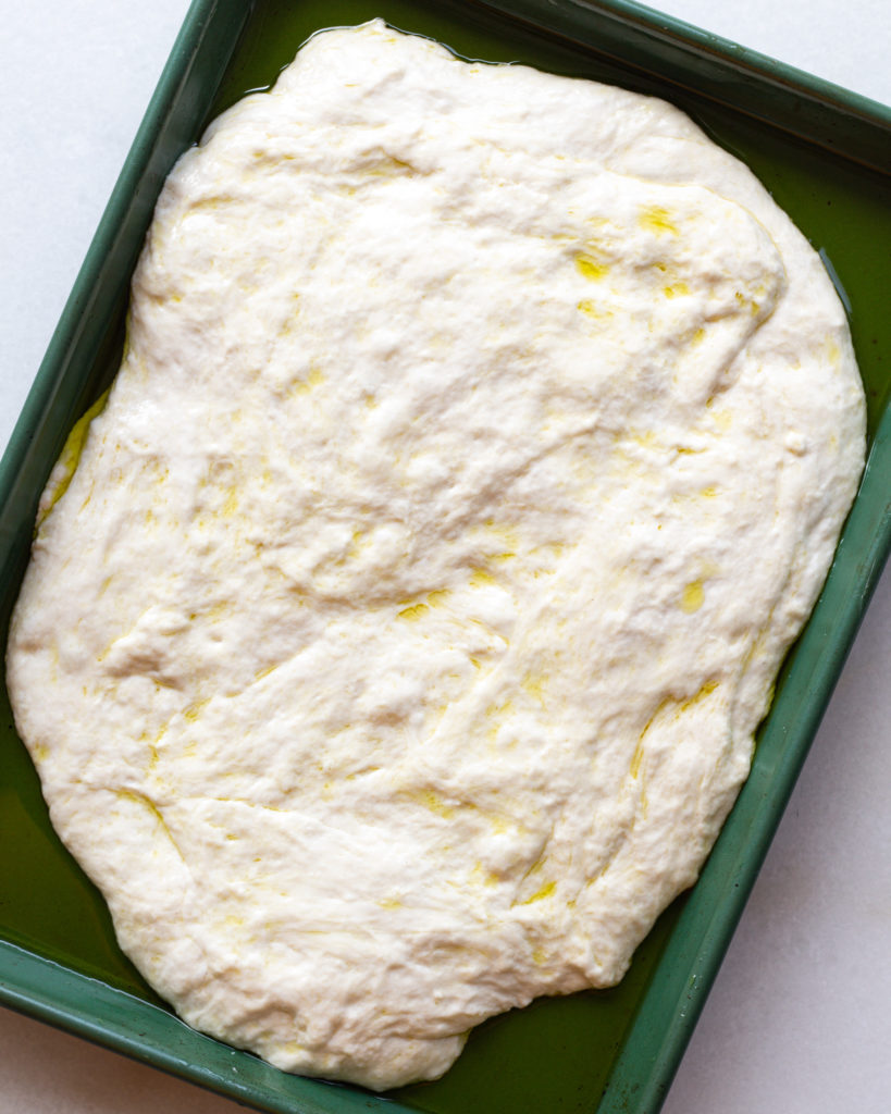 Genoa Style Focaccia dough in pan with olive oil