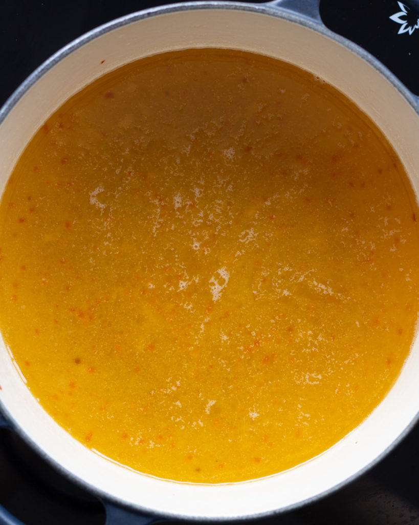 Egg soup broth in pot