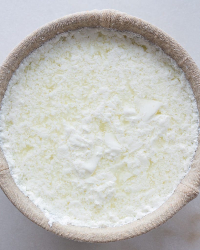 Whole milk ready to strain through cheese cloth