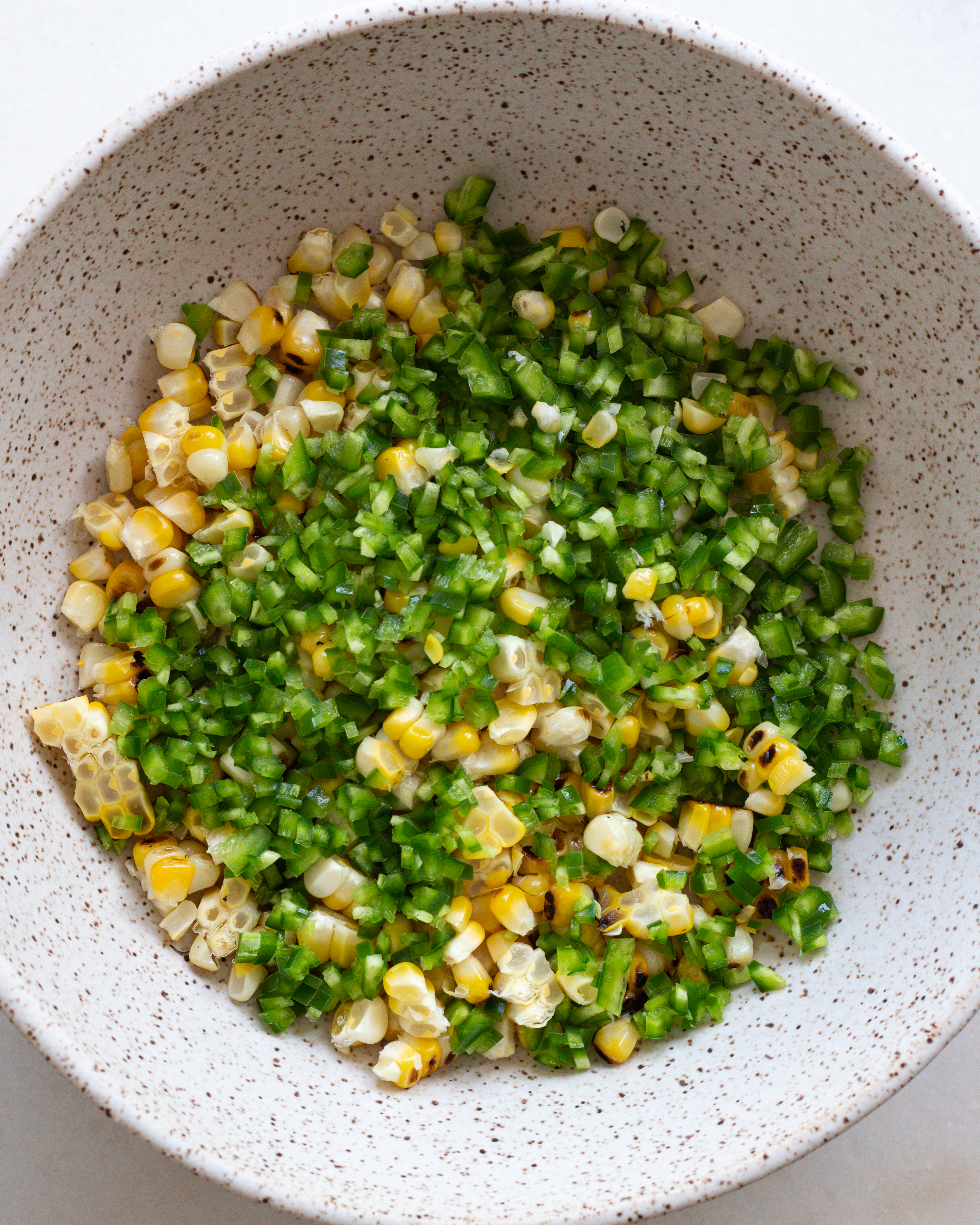 Diced pepper with corn in bowl