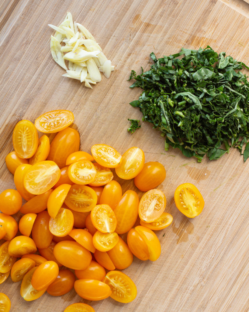 Sliced tomatoes, basil and garlic