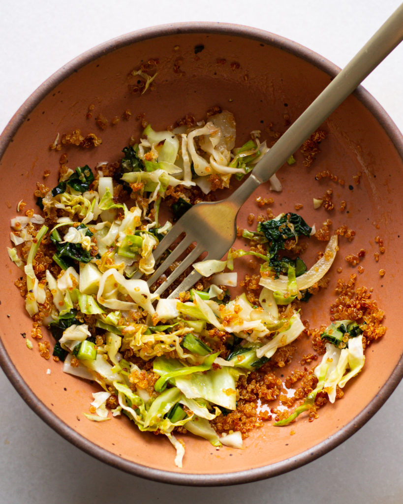 Half-eaten Baked Kale Salad with Crispy Quinoa
