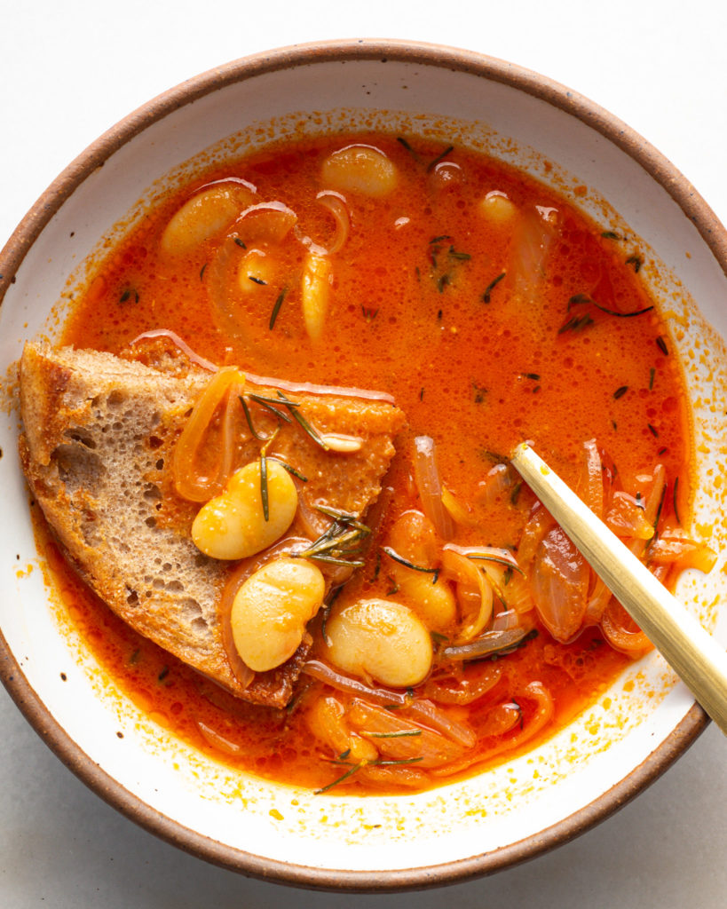 Finsihed Gochujang Brothy Beans with slice of bread
