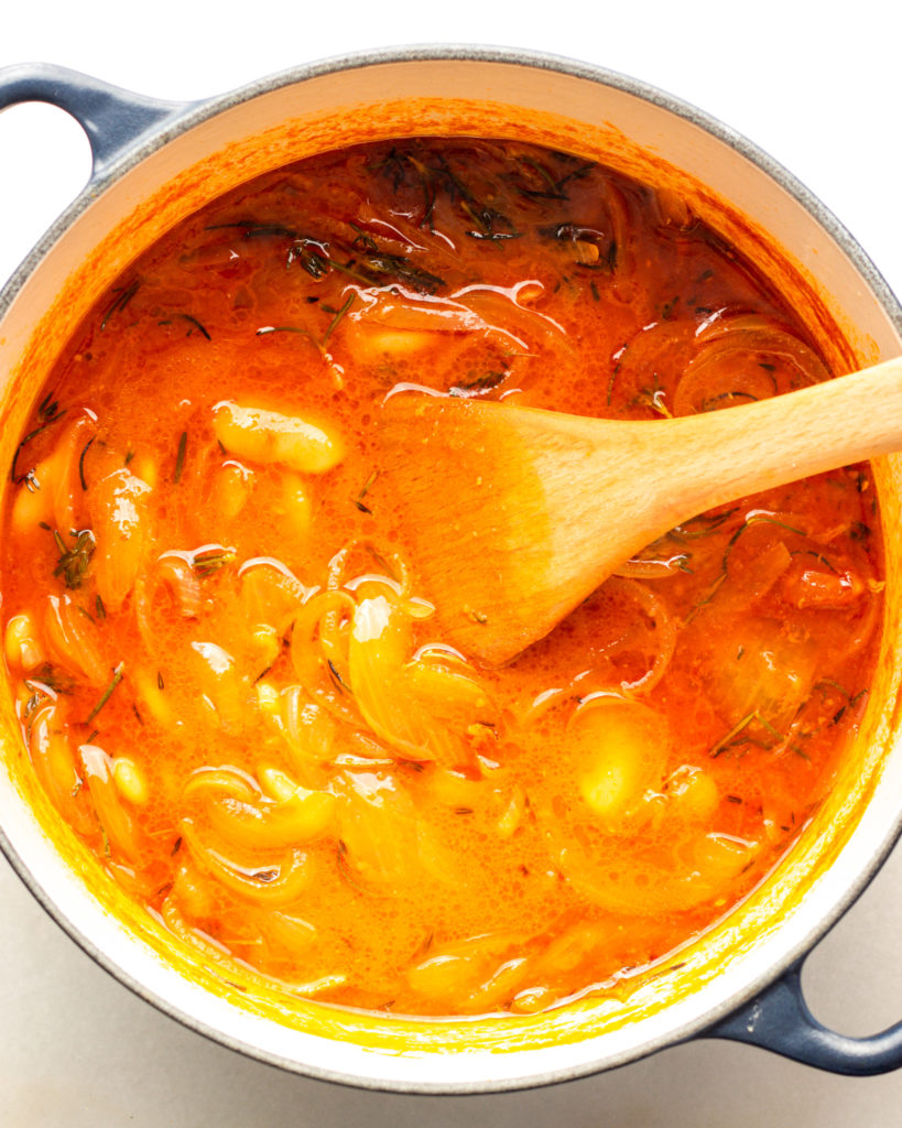 Brothy beans simmering in pot