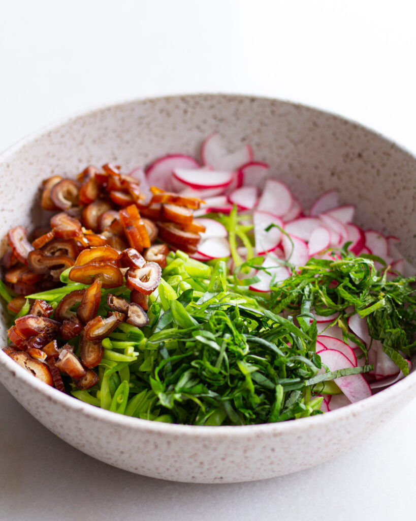 ingredients for the raw salad in a bowl