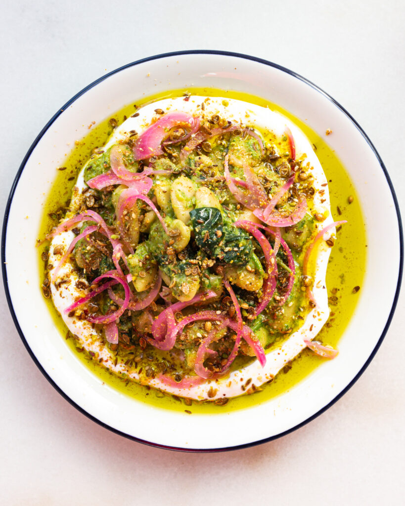Preserved Lemon Zhoug Beans with Labneh in a bowl
