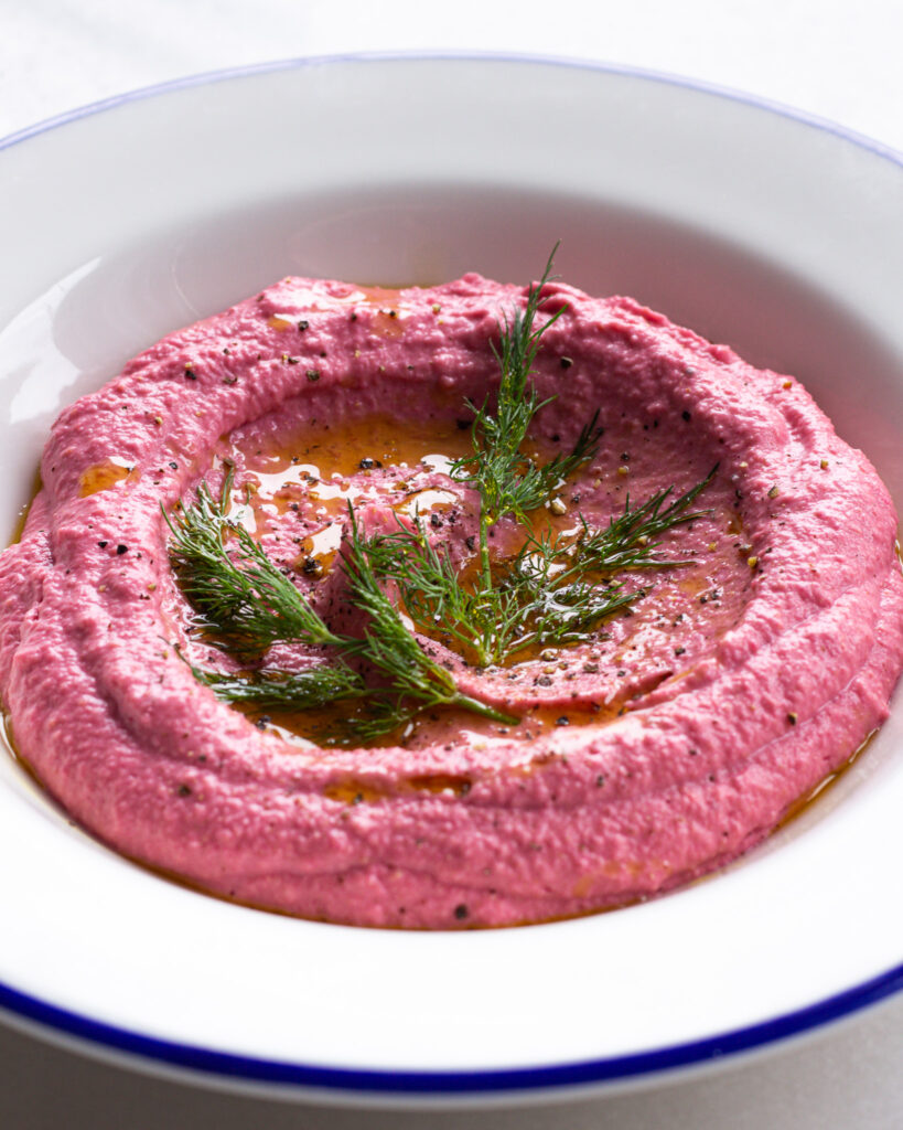 Finished beet hummus with dill topping