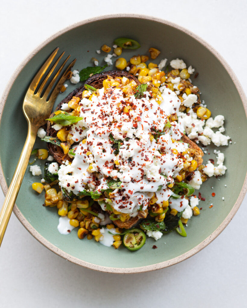 Finished cumin corn with garlic lime dressing
