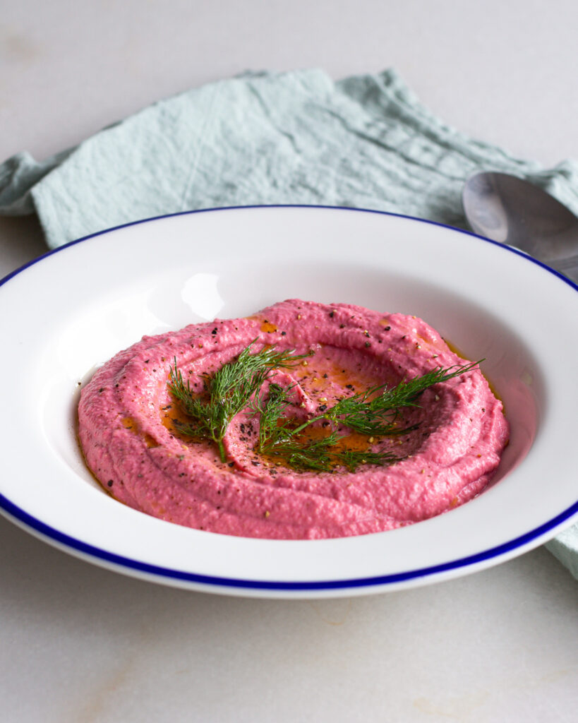 Finished beet hummus with dill topping
