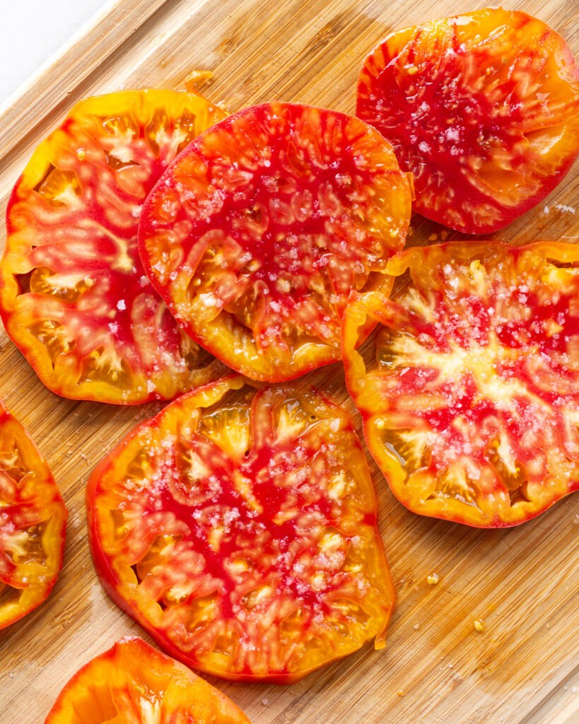 Sliced heirloom tomatoes with flaky salt
