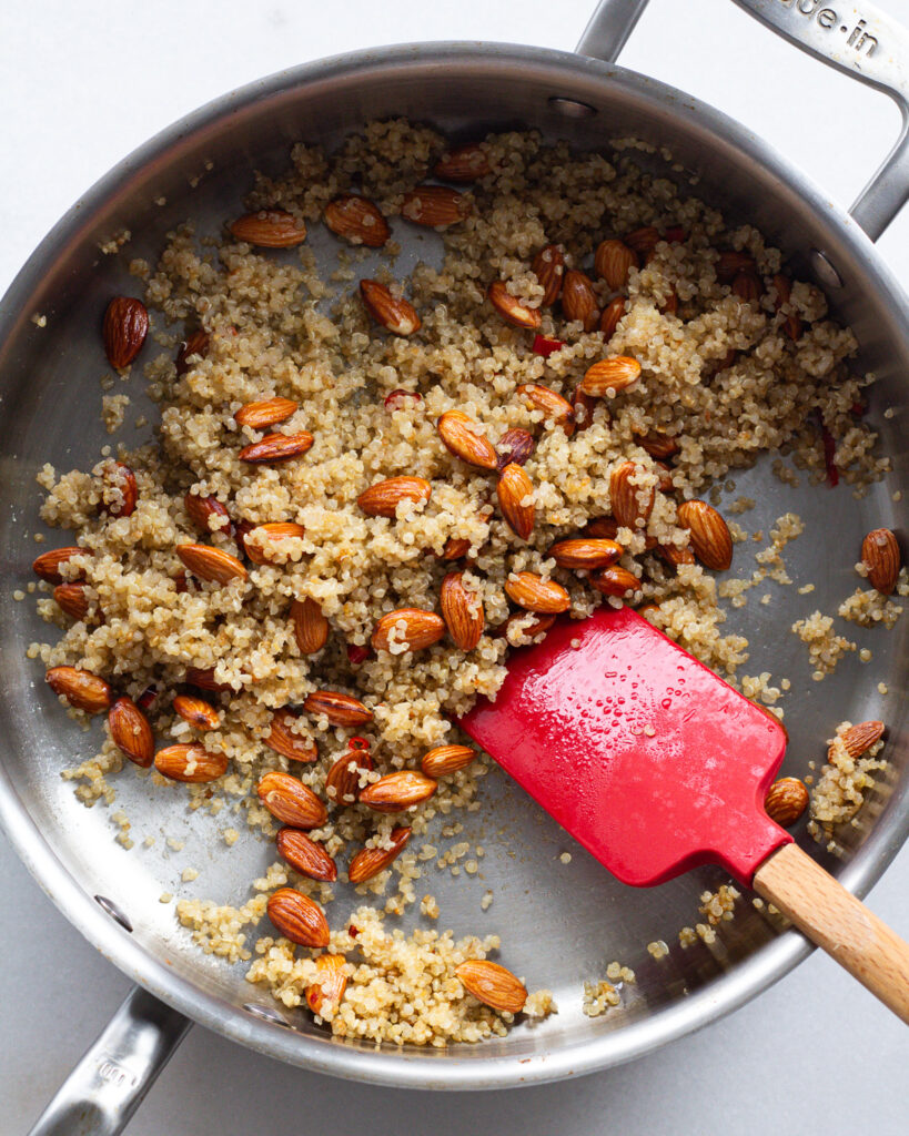 Quinoa and almonds in pan
