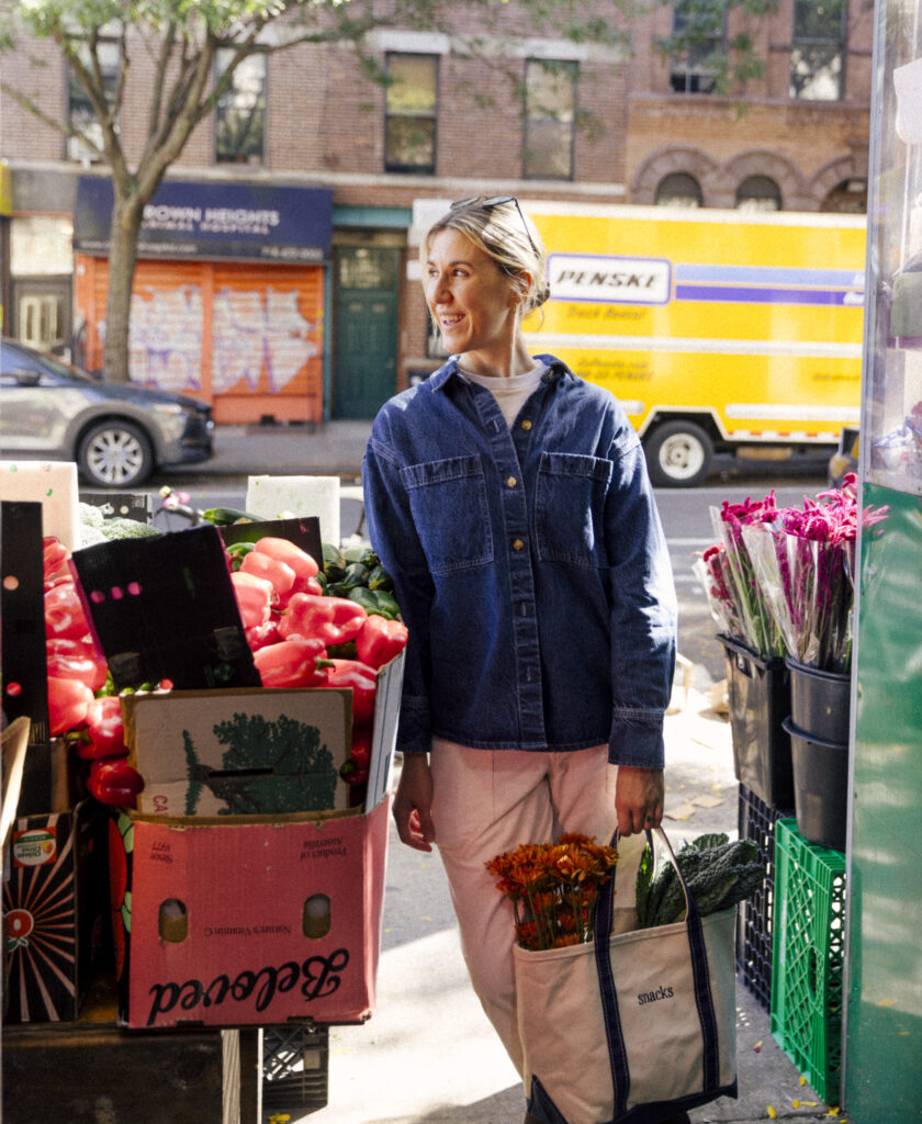 Justine smiling at flower stand