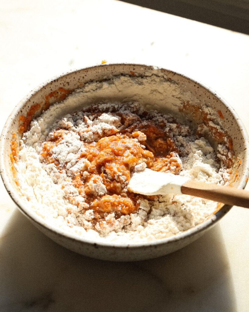 the batter for a vegan carrot muffin recipe