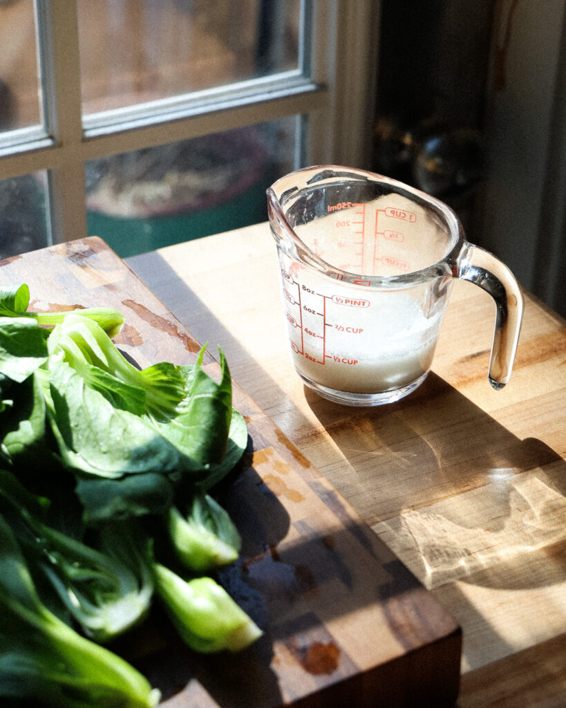 the slurry for a dumpling skirt, sitting next to some bok choy
