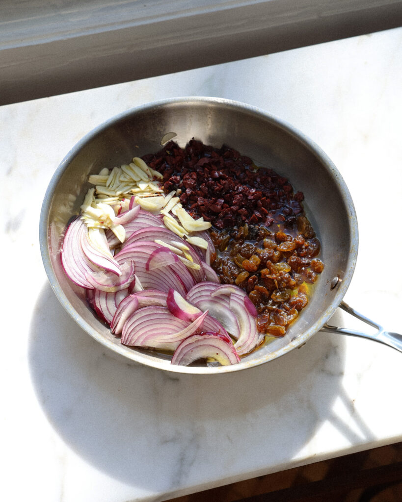 The ingredients for a golden raisin and kalamata olive gastrique 