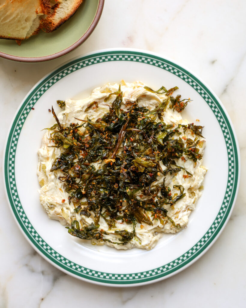 Spring onion dip on a plate.