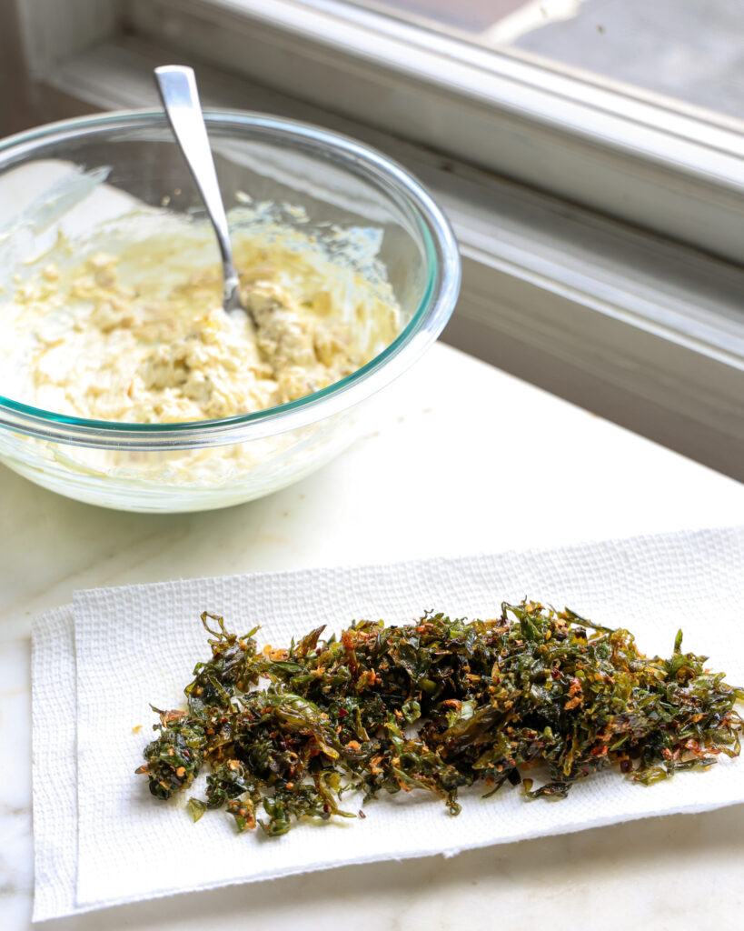 spring onion dip and fried spring onion greens draining on a paper towel