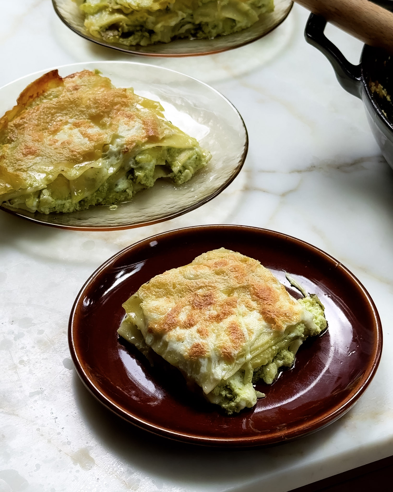 Squares of zucchini lasagna on a plate.