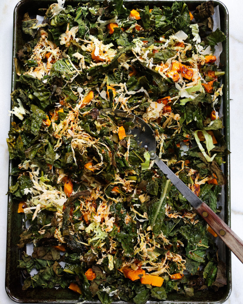 roasted salad all mixed on a sheet pan 