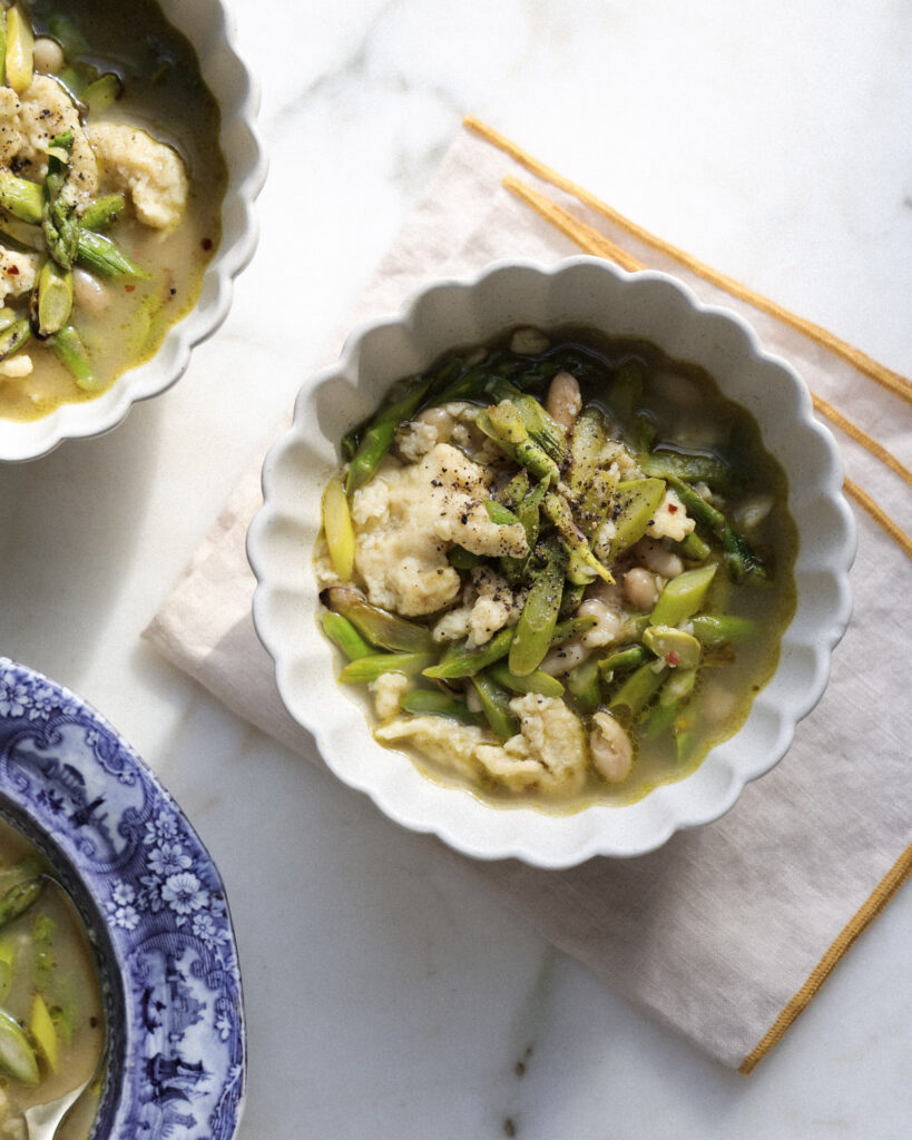 Lemon asparagus spaetzle divided into 3 bowls.