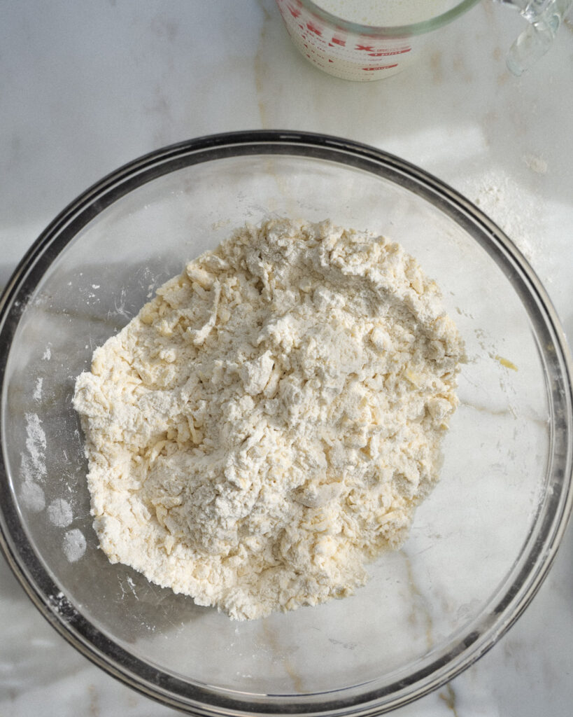 grated butter and flour in a bowl.