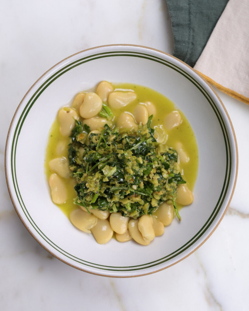 ingredients for olive citrus dressing a bowl.
