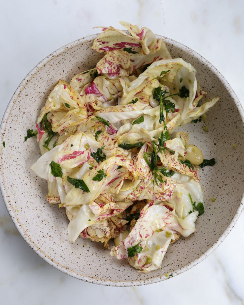 ingredients for chicory salad in a bowl.