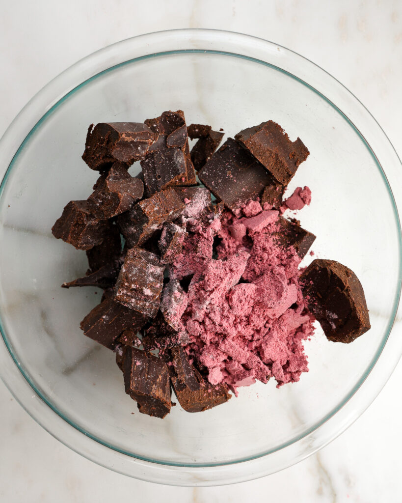 strawberry powder sprinkled on top of dark chocolate.