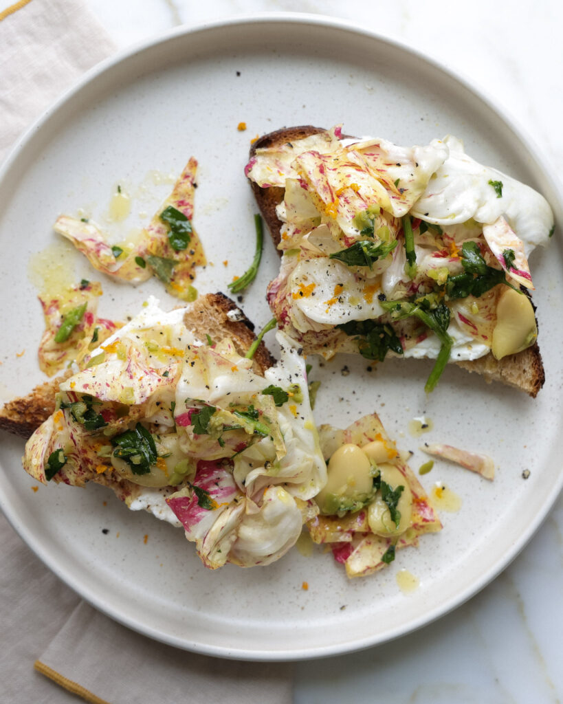 ingredients for chicory salad on top of ricotta toast