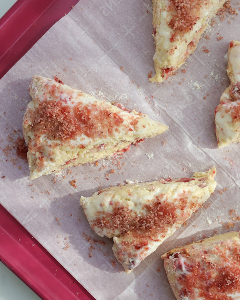 unbaked strawberry scones topped with pink sugar