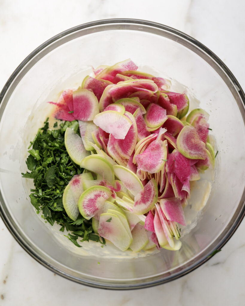 Wateremlon radishes and parsley in a bowl