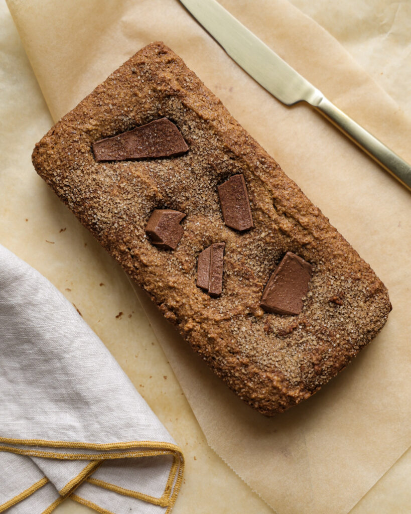 Chocolate churro loaf on parchment paper.