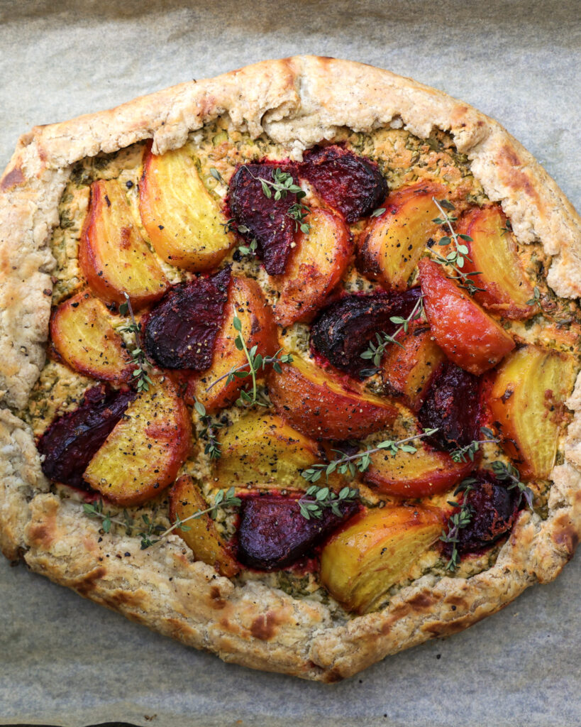 Beet tart topped with fresh thyme.