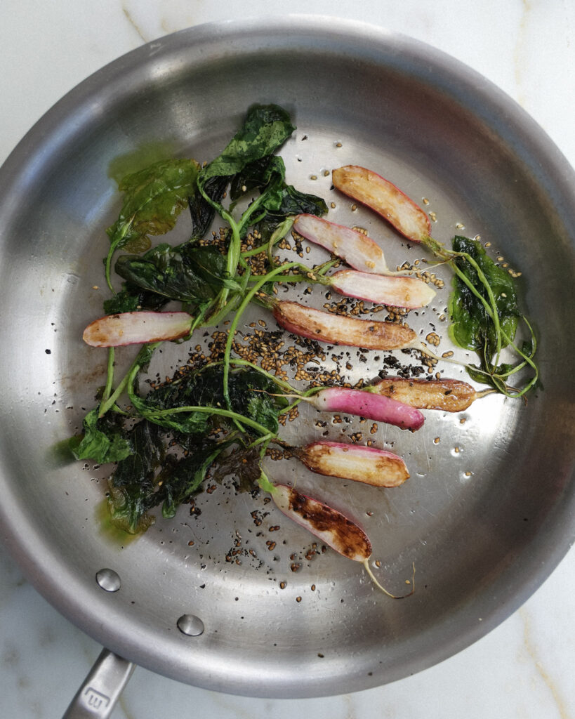 breakfast radishes being seared on a pan.