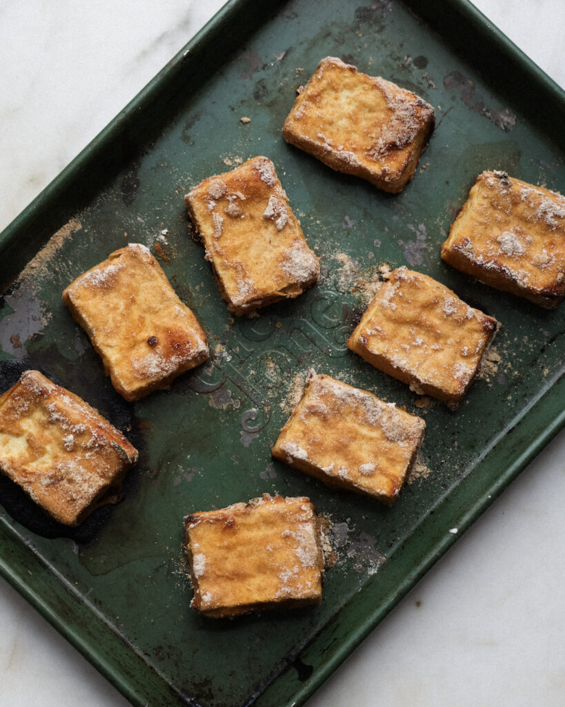 baked tofu slices on a baking sheet.