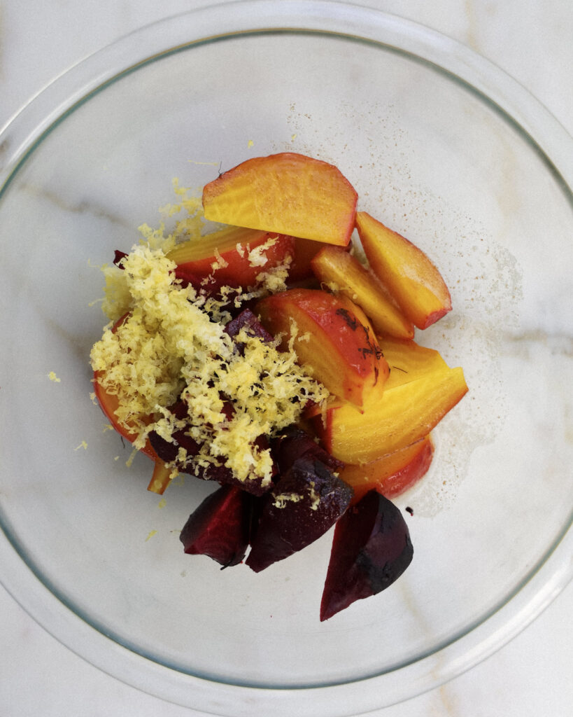 roasted beets with lemon zest and brown butter in a bowl.