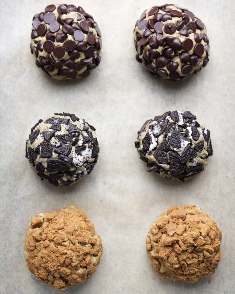 3 different Gideon's bakehouse cookie flavors - chocolate chip, oreo, and biscoff.