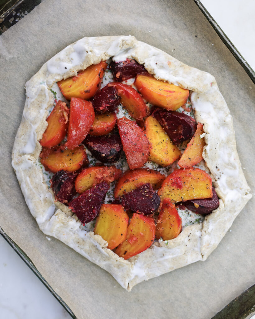 Roasted beets on top of goat cheese mixture.