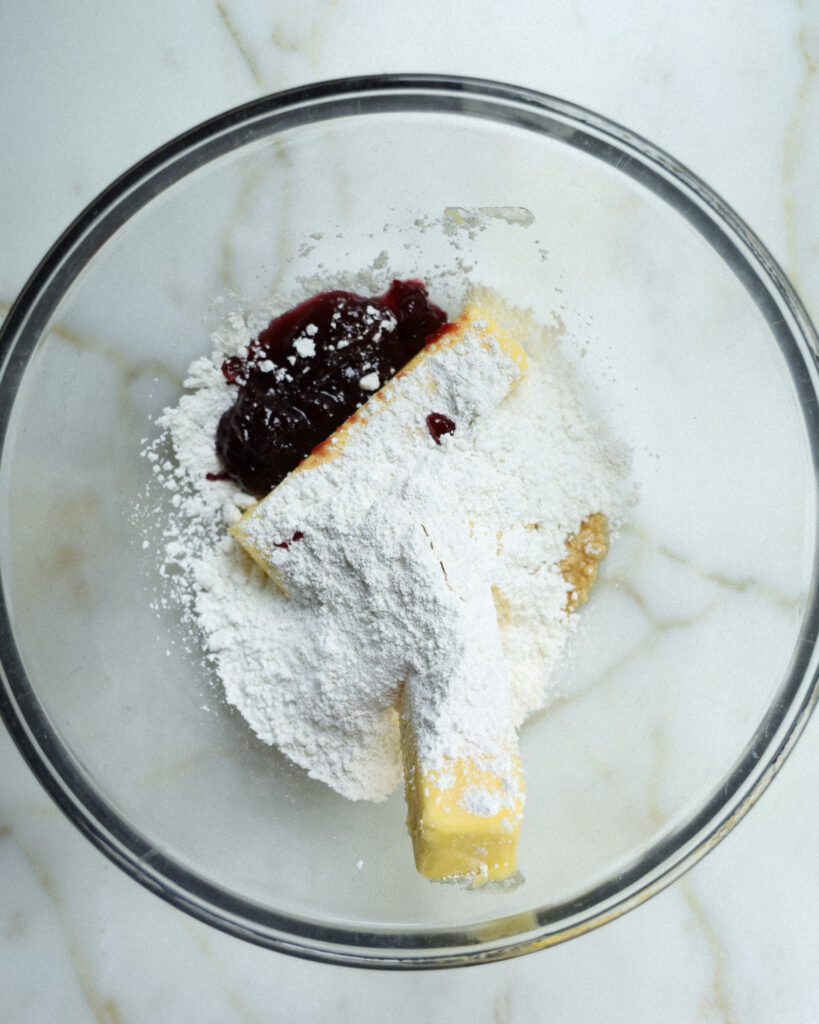 Ingredients for strawberry jam cookies in a bowl.