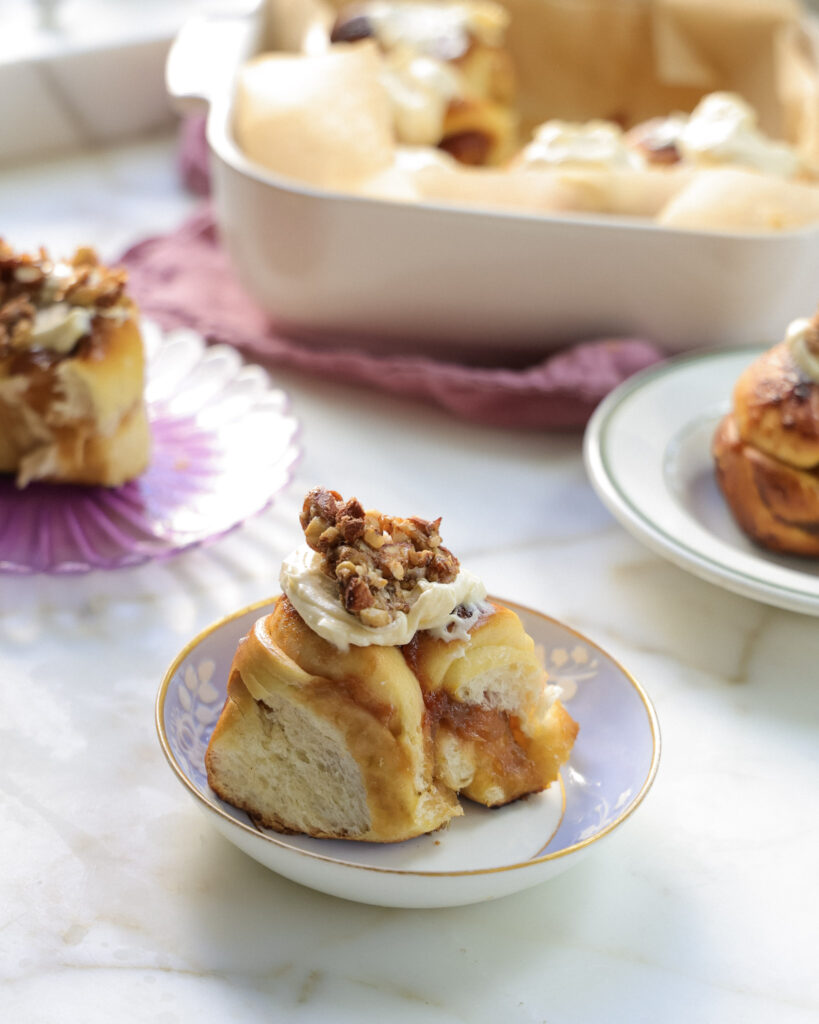 Rhubarb rolls topped with ginger nuts and lemon frosting.