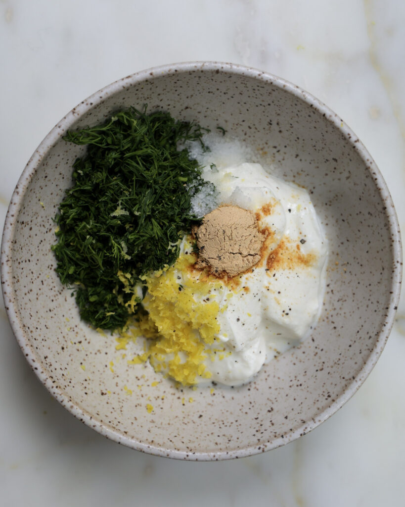 Ingredients for yogurt spread in a bowl.