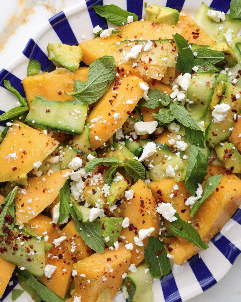 cucumber melon salad topped with mint and feta.
