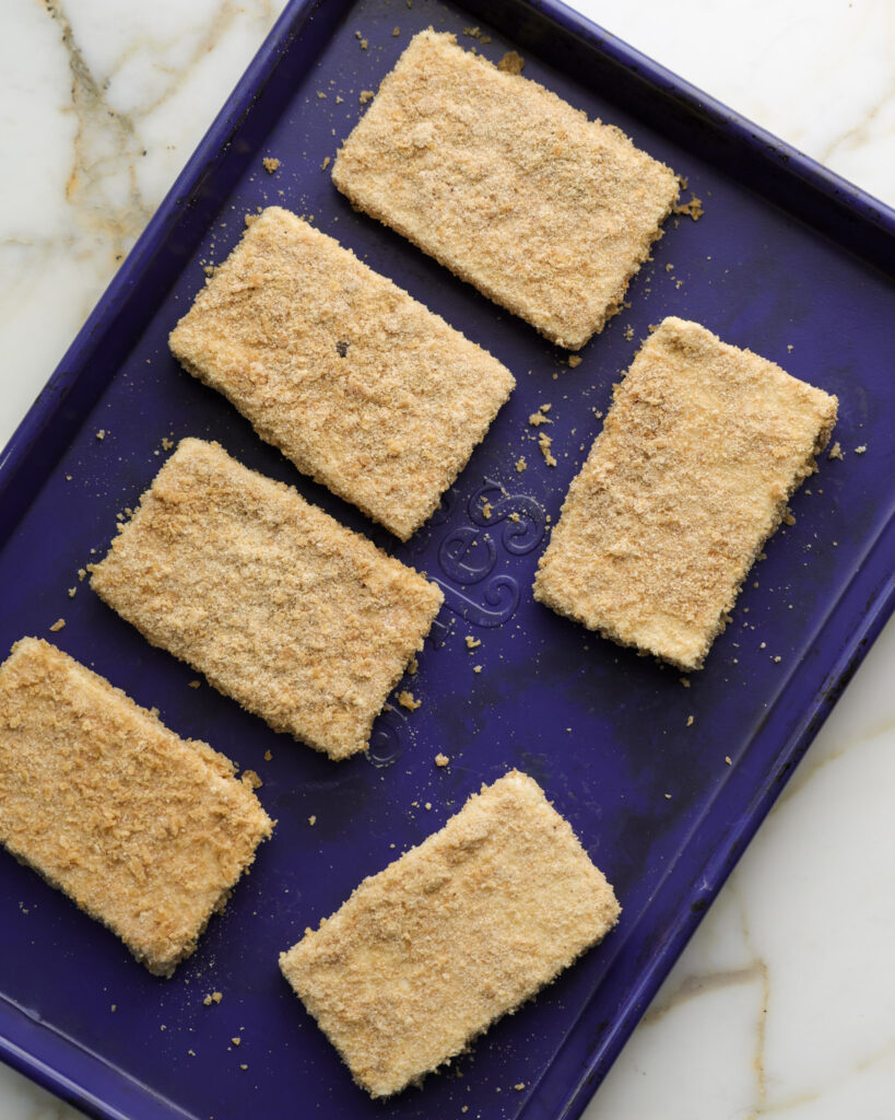 Tofu cutlets on a baking sheet.