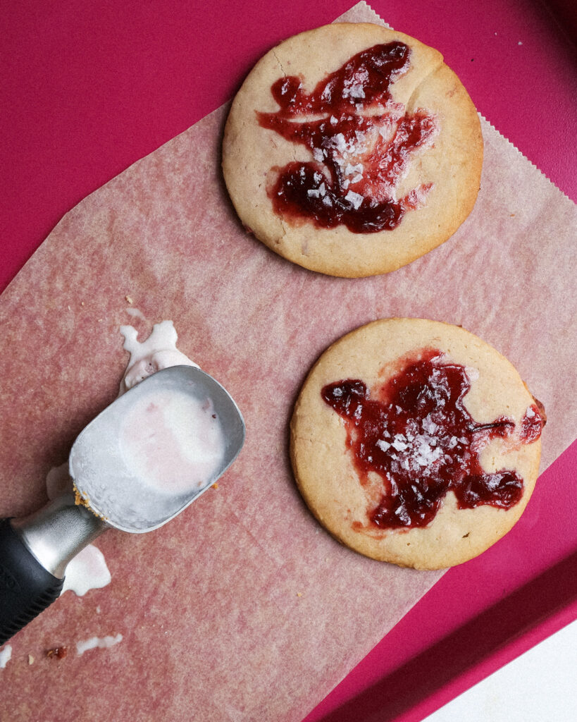 Baked cookies with jam swirled on top.