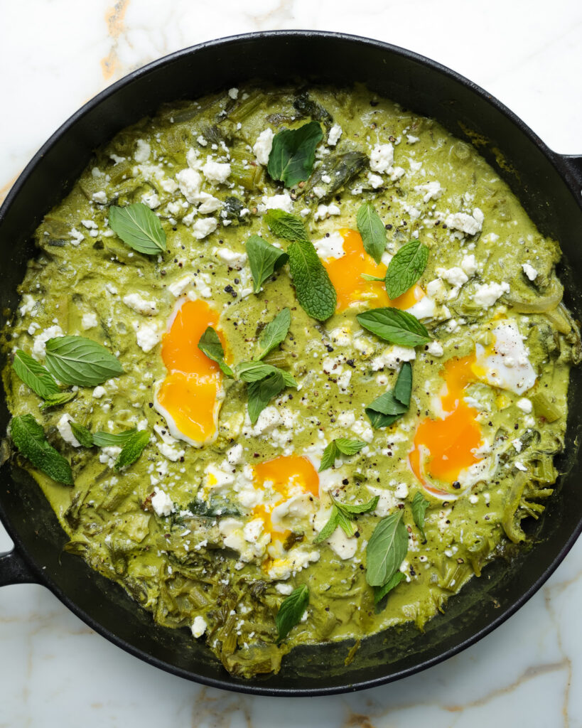 spring green shakshuka in a pan