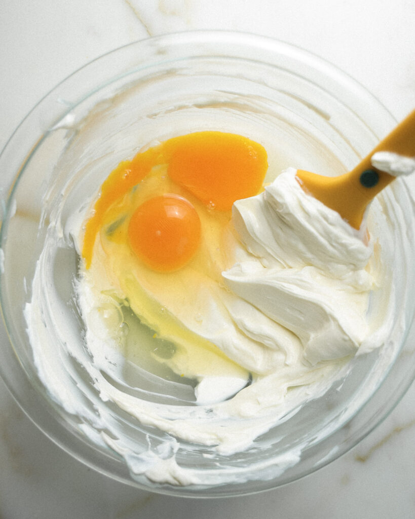 Gooey butter layer ingredients being mixed