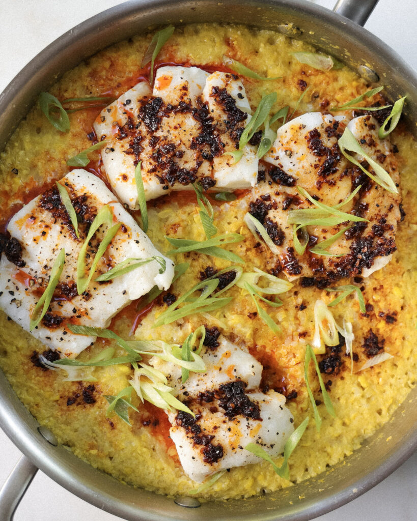 Cod over miso corn rice topped with scallions and chili crisp.