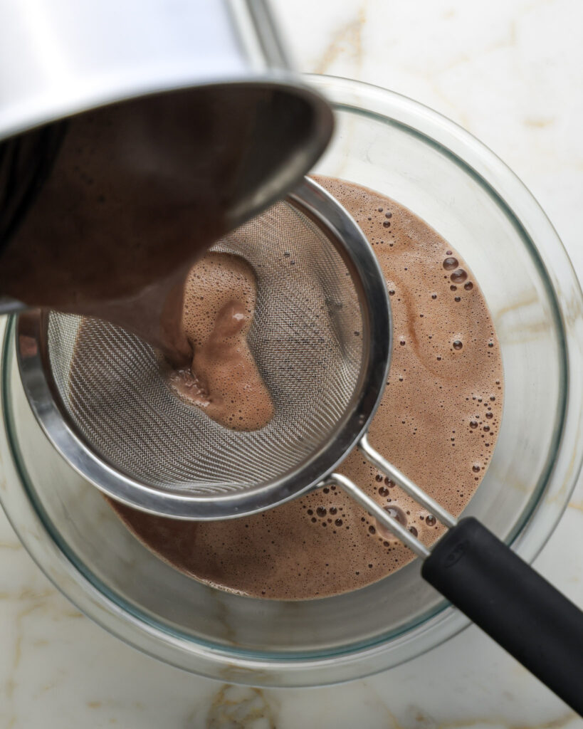 Chocolate custard being strained