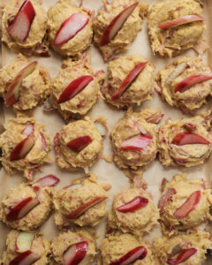 Rhubarb cookie dough balls with slices of rhubarb on top.